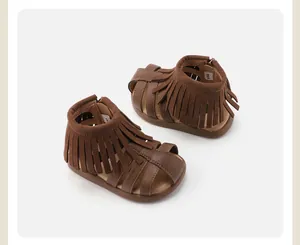 Detailed view of brown toddler fringe sandals with soft non-slip soles for summer wear