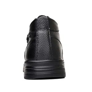 Rear view of black genuine leather men's high-top snow boots showing textured heel and thick sole
