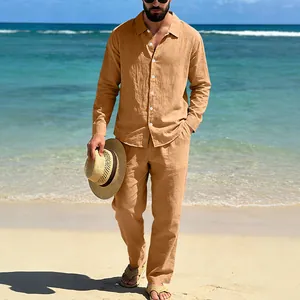 Men's loose linen two-piece set with long sleeve shirt and straight pants on beach