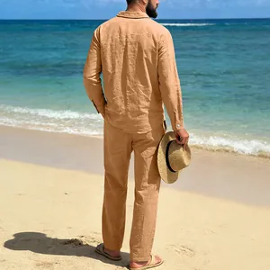 Detailed back view of men's tan linen long-sleeve shirt and straight pants set at the beach
