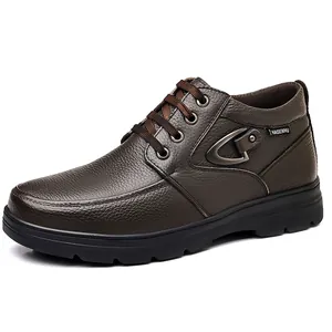 Side view of men's brown leather high-top boot with textured finish and buckle detail