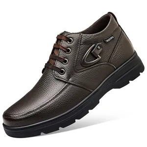 Detailed side view of brown men's high-top leather casual boots with metal buckle.