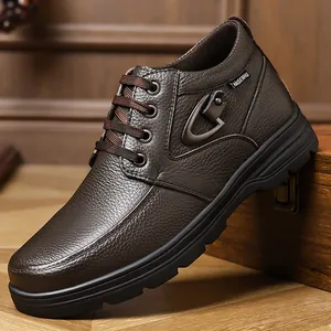 Detailed view of dark brown genuine leather men's high-top casual boots with textured finish