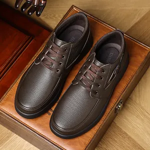 Macro view of dark brown men's leather casual shoes featuring exquisite pebble grain texture