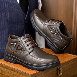 Detailed macro shot of brown high-top leather shoes featuring textured finish and laces