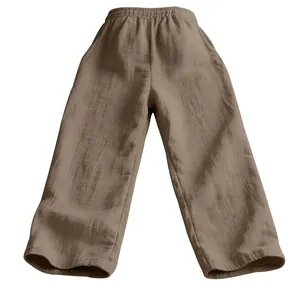 Vue détaillée du pantalon large en lin marron pour homme avec tissu texturé et taille