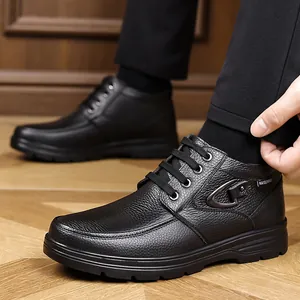 Detailed macro view of black genuine leather high-top casual men's boots with laces