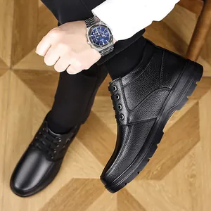 Close-up of black men's high-top leather boots showing the premium lychee texture
