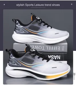 Side view of grey gradient breathable sports sneakers with thick white soles and laces