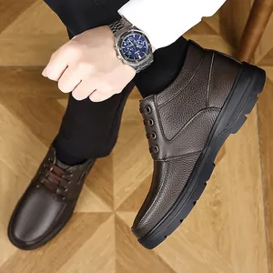 Close-up of men's brown leather high-top casual shoes with durable rubber soles.
