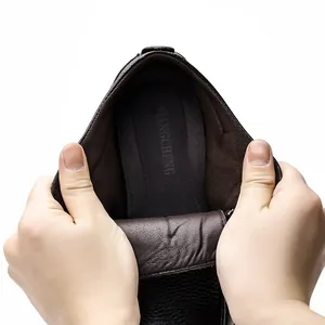 Detail of premium leather men's snow boot interior showing soft lining and flexibility