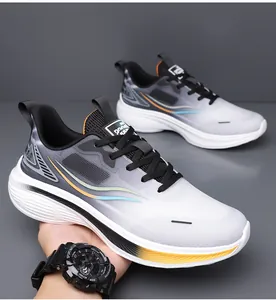 Macro detail of men's breathable mesh sneakers featuring a gradient grey and white design.