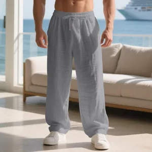 Détail du tissu en lin gris respirant et de la taille à cordon de ce pantalon large pour homme