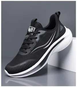 Profile view of black mesh running shoe with white chunky sole