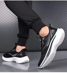 Side view of men's breathable black sneakers with thick cushioned white soles for running