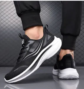 Detailed side view of breathable black mesh men's running shoes with soft white cushioned soles.