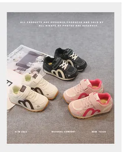 Detail of breathable mesh kids sneakers in pink, white, and black colors