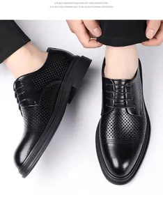 Detailed view of black perforated men's dress shoes with breathable hollowed design