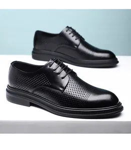 Side view of elegant black breathable leather dress shoes with decorative perforations