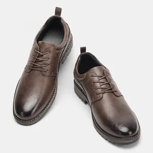 High-angle detailed shot of men's brown burnished dress shoes with lace-up closure.