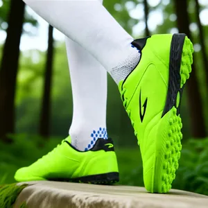 Vibrant lime green TF turf soccer shoes for youth and adults, ideal for training sessions