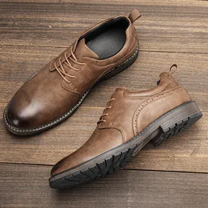 Close-up of brown burnished leather dress shoes with brogue detailing and textured sole.