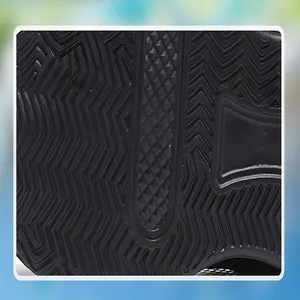 Detailed close-up of the black rubber anti-slip outsole of children's sports shoes.