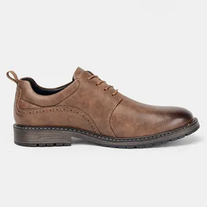 Side view of men's brown leather dress shoe showing classic brogue details and texture