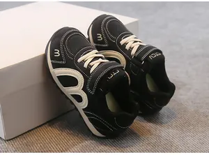 Detailed close-up view of lightweight black breathable mesh sneakers for children