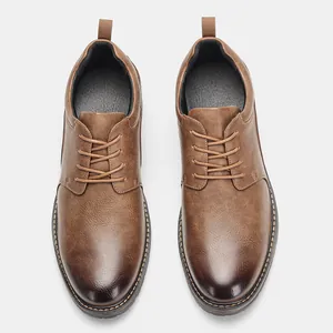 Top-down view of men's polished brown leather dress shoes with lace-up detail