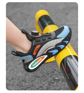 Detail of children's breathable mesh sneakers featuring a convenient rotary dial closure.