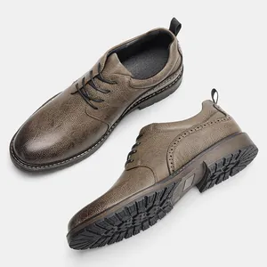 Detailed view of textured brown leather men's derby shoes with elegant brogue accents