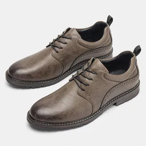 Close-up of brown men's casual leather shoes with elegant brogue detailing and laces
