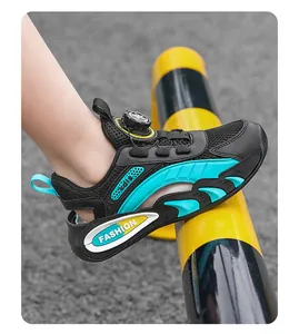 Close-up of children's breathable mesh sneakers with teal accents and dial lace system