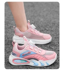 Detail of pink children's mesh sneakers featuring a convenient rotating buckle closure.