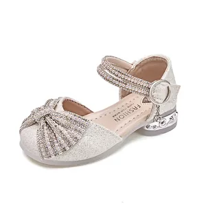Silver sparkly girls' princess shoes with rhinestone bow and decorative low heel
