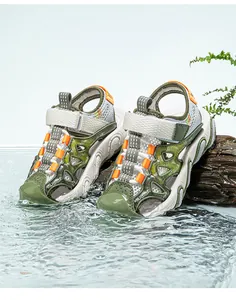 Close-up of children's green closed-toe mesh sandals in a water splash setting