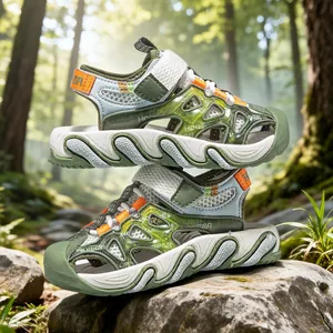 Breathable kids' closed-toe sport sandals in green and orange for outdoor hiking fun