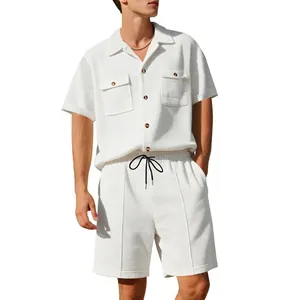 Detailed view of men's white waffle-knit short sleeve shirt and matching drawstring shorts set.