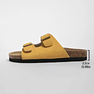Close-up detail of yellow suede slide sandal showing 2.5cm thick sole height measurement