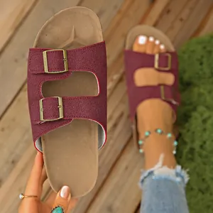 Detailed view of wine red Birkenstock-style platform sandals with dual buckles.