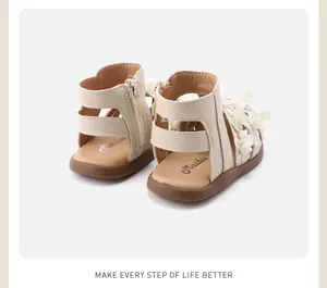 Detailed back view of infant girls' cream floral sandals featuring a secure heel zipper closure