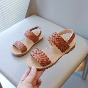 Fashionable girls' woven strap sandals in tan brown, perfect for summer beach and casual wear