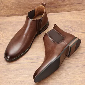 Close-up detail of classic brown leather Chelsea boots for men with side zipper