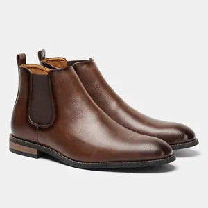Side profile of classic brown leather Chelsea boots with elastic side panels