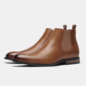 Side view of classic brown leather men's Chelsea boots with elastic side panels.