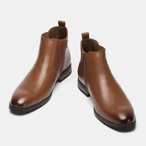 Classic brown leather men's Chelsea boots with side zipper and polished finish detail