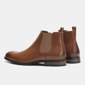 Detailed side view of classic brown leather Chelsea boots for men with elastic side