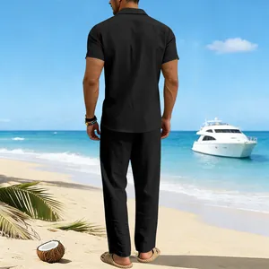 Men's black summer linen set with short-sleeved shirt and trousers on beach backdrop