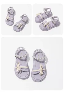 Elegant lavender princess sandals for girls featuring a bow and pearl strap details.